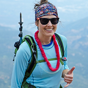 Hiker at the summit of Pikes Peak with a "hang loose" hand signal