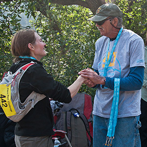 Volunteer holding medals